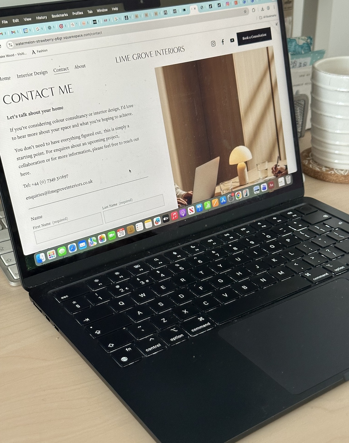 A laptop ready for an initial colour consultancy enquiry.
