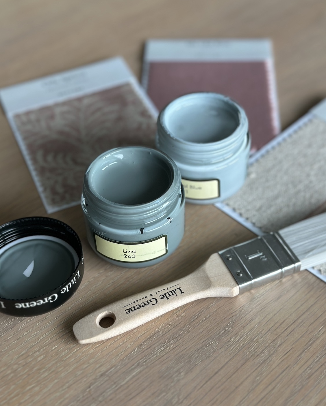 Paint samples and brushes being considered for an interior scheme.
